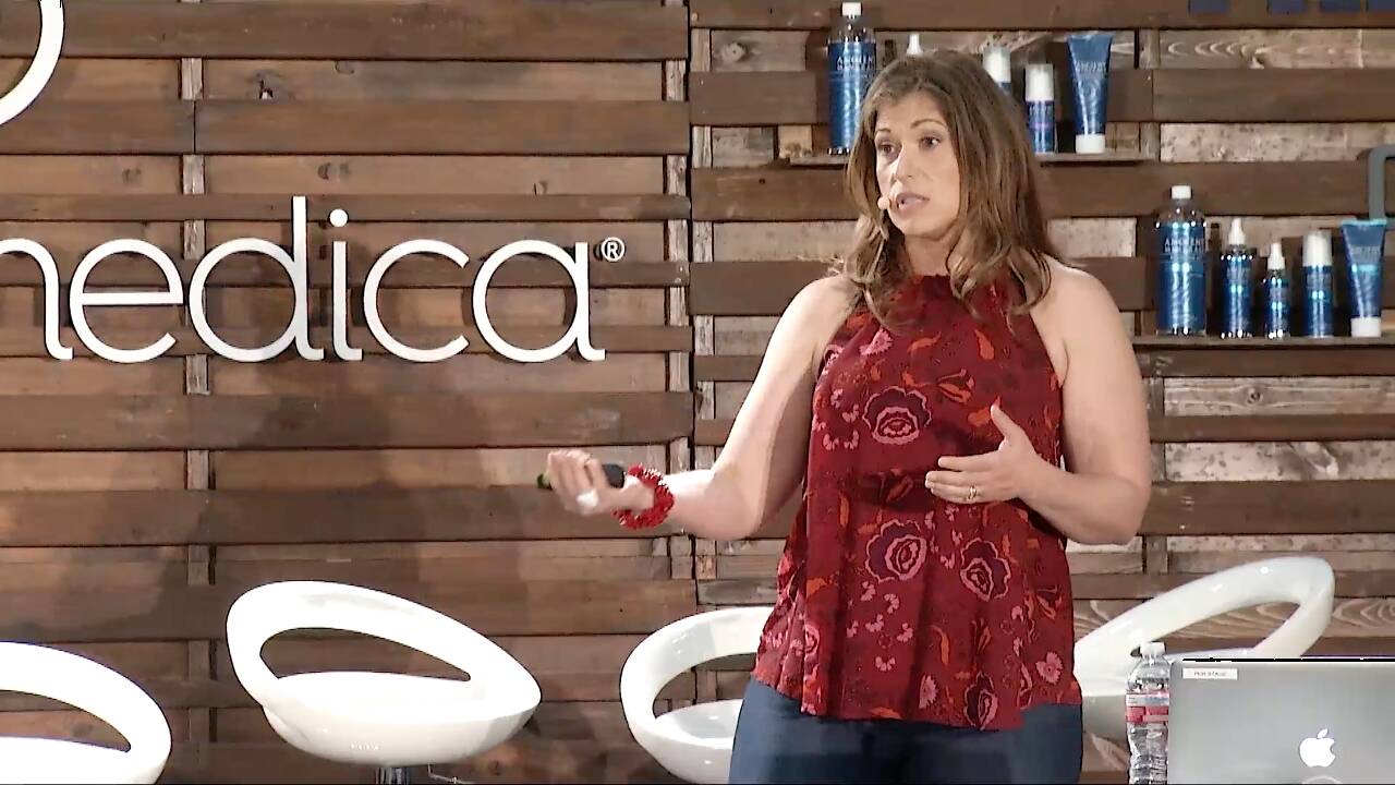 Dr. Sarah Ballantyne speaking on stage at the Paleo f(x) conference